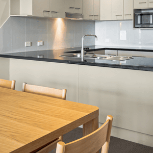 View of Dining table & kitchen in background
