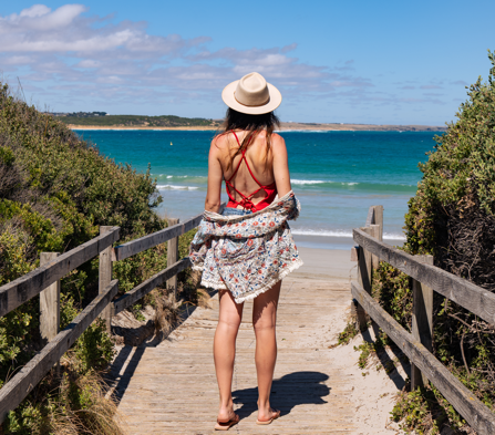 Girl enjoying the summer weather by the beach
